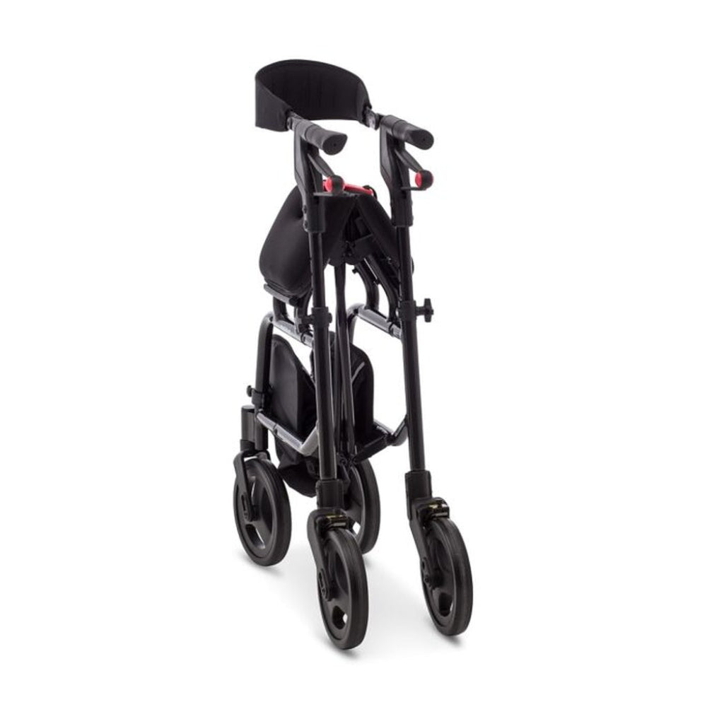 Human Care neXus 3 rollator in black folded compactly, standing on its own